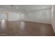 Spacious living room filled with natural light and featuring beautiful wood-look tile flooring at 4050 W Nora Dr, San Tan Valley, AZ 85144