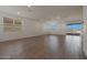 Bright living space featuring large windows and a sliding glass door to the outdoor area at 4050 W Nora Dr, San Tan Valley, AZ 85144
