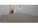 Large main bedroom featuring carpet and an open ensuite bath at 4050 W Nora Dr, San Tan Valley, AZ 85144