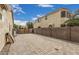 Spacious backyard patio area with privacy wall and clear blue skies perfect for entertaining at 4318 N 180Th Dr, Goodyear, AZ 85395