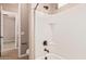 This bathroom features a white tile surround, and an oil rubbed bronze shower head at 4318 N 180Th Dr, Goodyear, AZ 85395