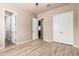 This bedroom offers neutral walls, plank flooring, closet, ceiling fan and an ensuite entrance at 4318 N 180Th Dr, Goodyear, AZ 85395