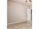 Bedroom featuring light-tone walls, wood-look flooring, and a ceiling fan at 4318 N 180Th Dr, Goodyear, AZ 85395