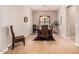 A spacious dining room features neutral walls, a chandelier, and a wood table at 4318 N 180Th Dr, Goodyear, AZ 85395