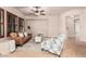 Beautiful living room with a plush sofa, armchair, and shuttered windows at 4318 N 180Th Dr, Goodyear, AZ 85395