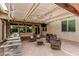 The outdoor living space features a built-in bbq, hot tub, and covered seating at 4318 N 180Th Dr, Goodyear, AZ 85395