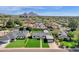 Picturesque aerial view showcasing a neighborhood with charming homes, mature trees, and stunning mountain views at 4809 N 30Th Pl, Phoenix, AZ 85016