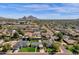 Picturesque aerial view showcasing a neighborhood with charming homes, mature trees, and stunning mountain views at 4809 N 30Th Pl, Phoenix, AZ 85016