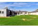 Spacious backyard with well-manicured lawn, a neutral-tone exterior, and a modern design for outdoor enjoyment at 4809 N 30Th Pl, Phoenix, AZ 85016