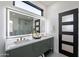 Bathroom with a double vanity and a stand alone tub and glass enclosed shower at 4809 N 30Th Pl, Phoenix, AZ 85016
