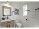 Bright bathroom featuring a modern vanity, contemporary fixtures, and a white toilet at 4809 N 30Th Pl, Phoenix, AZ 85016