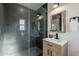 The bathroom features a modern vanity, sleek fixtures, and a glass-enclosed shower at 4809 N 30Th Pl, Phoenix, AZ 85016