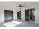 Bedroom with a ceiling fan and ensuite bathroom with sliding barn door at 4809 N 30Th Pl, Phoenix, AZ 85016