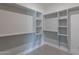 A well designed and organized walk in closet with shelves and space for hanging at 4809 N 30Th Pl, Phoenix, AZ 85016