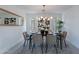 Bright dining room with modern light fixture, artwork, and comfortable seating for six at 4809 N 30Th Pl, Phoenix, AZ 85016