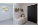 Bright entryway featuring a bench with pillows and a coat rack at 4809 N 30Th Pl, Phoenix, AZ 85016