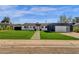 Beautifully renovated single story home with green grass, walkway and modern exterior at 4809 N 30Th Pl, Phoenix, AZ 85016