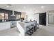 Bright kitchen features an island with seating, stainless steel appliances, and a black accent wall at 4809 N 30Th Pl, Phoenix, AZ 85016