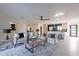 Open-concept living room flows into kitchen, featuring stylish furniture and a ceiling fan at 4809 N 30Th Pl, Phoenix, AZ 85016