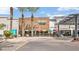 Outdoor setting with colorful umbrellas near a Blanco Tacos & Tequila restaurant, surrounded by palm trees at 4809 N 30Th Pl, Phoenix, AZ 85016