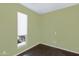 This bedroom features hardwood floors, a bright window, and neutral paint at 5236 N 16Th Ln, Phoenix, AZ 85015
