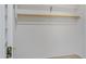 A closet featuring a wooden clothes rod and shelving for optimal storage at 5236 N 16Th Ln, Phoenix, AZ 85015