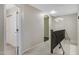 Hallway landing with arched doorways, neutral paint and carpeted floors at 5236 N 16Th Ln, Phoenix, AZ 85015