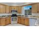 Kitchen featuring stainless steel appliances, granite countertops and view through kitchen window at 5236 N 16Th Ln, Phoenix, AZ 85015