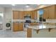 Kitchen features granite countertops, stainless steel appliances, tile flooring and breakfast bar at 5236 N 16Th Ln, Phoenix, AZ 85015