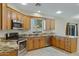 Well-lit kitchen featuring stainless steel appliances, granite countertops and ample cabinet space at 5236 N 16Th Ln, Phoenix, AZ 85015