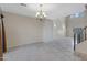 Bright living room with tiled floors, chandelier lighting, and plenty of space for entertaining at 5236 N 16Th Ln, Phoenix, AZ 85015