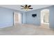Large main bedroom with an open doorway, television mount, and ensuite bathroom at 5236 N 16Th Ln, Phoenix, AZ 85015