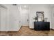 Welcoming foyer with tiled flooring, hall closet and console table with decor at 5258 E Elena Ave, Mesa, AZ 85206