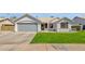 Charming single-story home with a well-maintained lawn and neutral-colored exterior at 5258 E Elena Ave, Mesa, AZ 85206