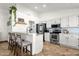 Modern kitchen with granite countertops, stainless steel appliances, and bar seating at 5258 E Elena Ave, Mesa, AZ 85206