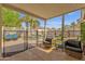 Relaxing covered patio with comfortable seating overlooking a beautiful private backyard pool at 5258 E Elena Ave, Mesa, AZ 85206