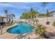 Backyard oasis with a pool, spa, basketball court, and lush tropical landscaping at 5258 E Elena Ave, Mesa, AZ 85206