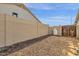 Side yard with a gravel area and block fence for added privacy and security at 5258 E Elena Ave, Mesa, AZ 85206