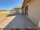 Backyard with a brick patio and sliding glass door to the home at 5639 N 46Th Ave, Glendale, AZ 85301