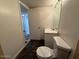 View of a bathroom featuring neutral colors, a single sink vanity, and a standard toilet at 5639 N 46Th Ave, Glendale, AZ 85301