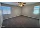 Spacious carpeted bedroom with ceiling fan and ample natural light at 5639 N 46Th Ave, Glendale, AZ 85301