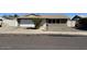 Single-story home with a large front yard, gravel landscaping, and a two-car garage at 5639 N 46Th Ave, Glendale, AZ 85301