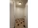 Hallway featuring unique tiled floor, white walls, and standard door at 5639 N 46Th Ave, Glendale, AZ 85301
