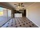 Combined kitchen and living area with access to backyard and dark stone countertops at 5639 N 46Th Ave, Glendale, AZ 85301