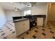 Well-equipped kitchen with black appliances, dark countertops, and white cabinetry at 5639 N 46Th Ave, Glendale, AZ 85301