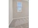 Bright bedroom featuring neutral walls, plush carpeting, and a window with natural light at 5832 E Covey Ln, Phoenix, AZ 85054
