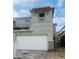 Two-story home featuring a wide garage and decorative stone accents on its façade at 5832 E Covey Ln, Phoenix, AZ 85054
