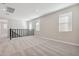 Upstairs bonus room with plush carpeting, many windows, and natural lighting at 5832 E Covey Ln, Phoenix, AZ 85054
