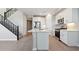 Bright kitchen features white cabinets, stainless steel appliances, and a large island at 5832 E Covey Ln, Phoenix, AZ 85054