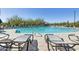 Sparkling community pool with comfortable lounge chairs and a serene setting at 5832 E Covey Ln, Phoenix, AZ 85054